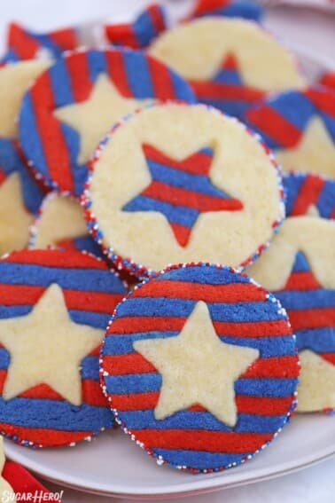 Red, white, and blue sugar cookies with striped stars embedded inside.