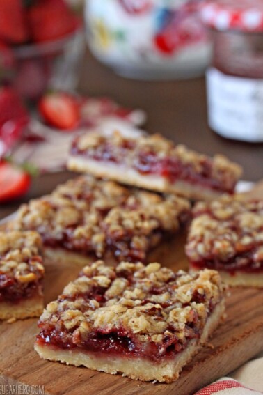 Strawberry Basil Crumb Bars cut in squares on a cutting board.