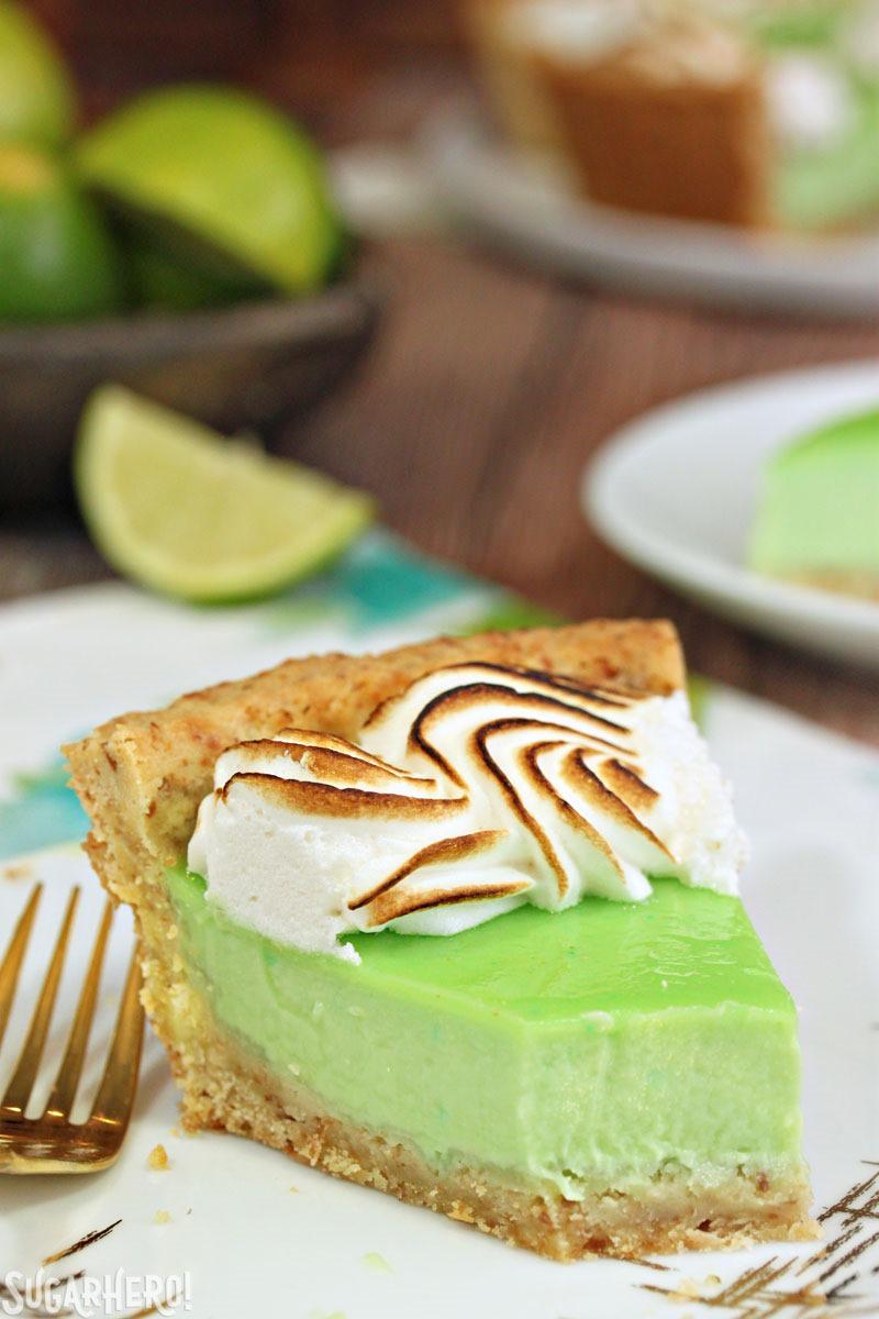 Toasted Coconut Lime Meringue Tart - with a tangy lime filling and toasted meringue on top! | From SugarHero.com