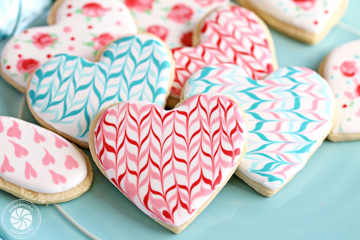 Valentine's Day Sugar Cookies decorated with royal icing in a colorful zig-zag pattern.