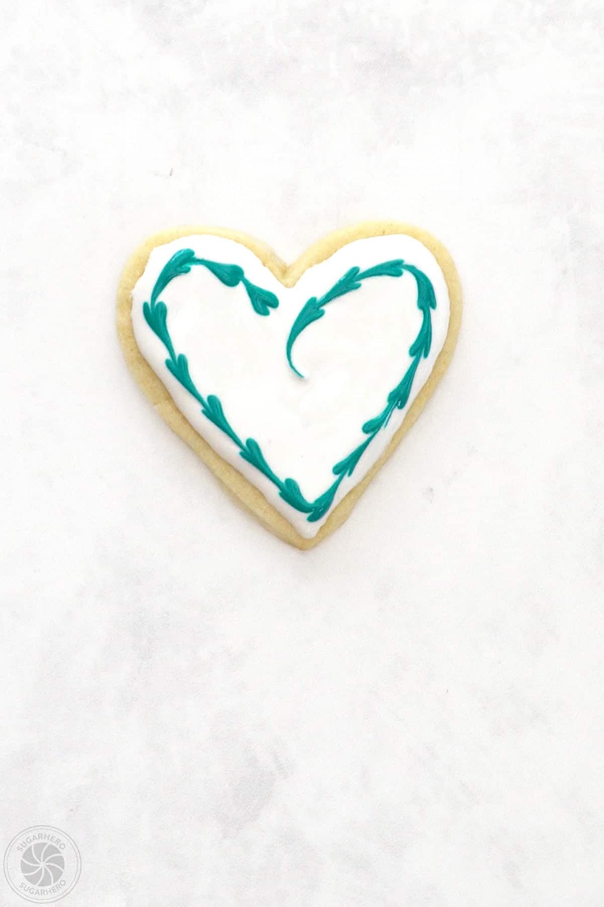 Valentine's Day Sugar Cookie with a swirled heart outline.
