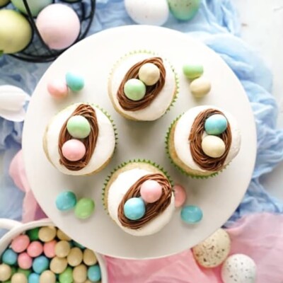4 Vanilla Bean Easter Egg Cupcakes on a white plate for Easter Cupcake Round up.