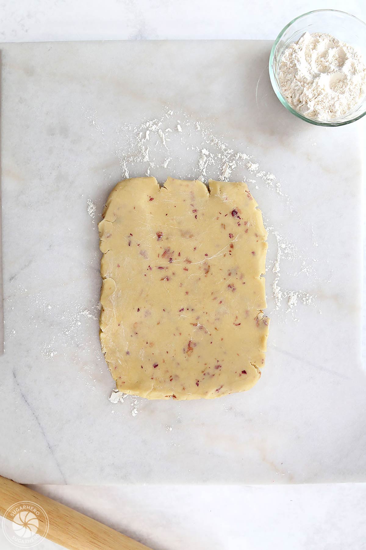 Rose sugar cookie dough rolled into a rectangle.