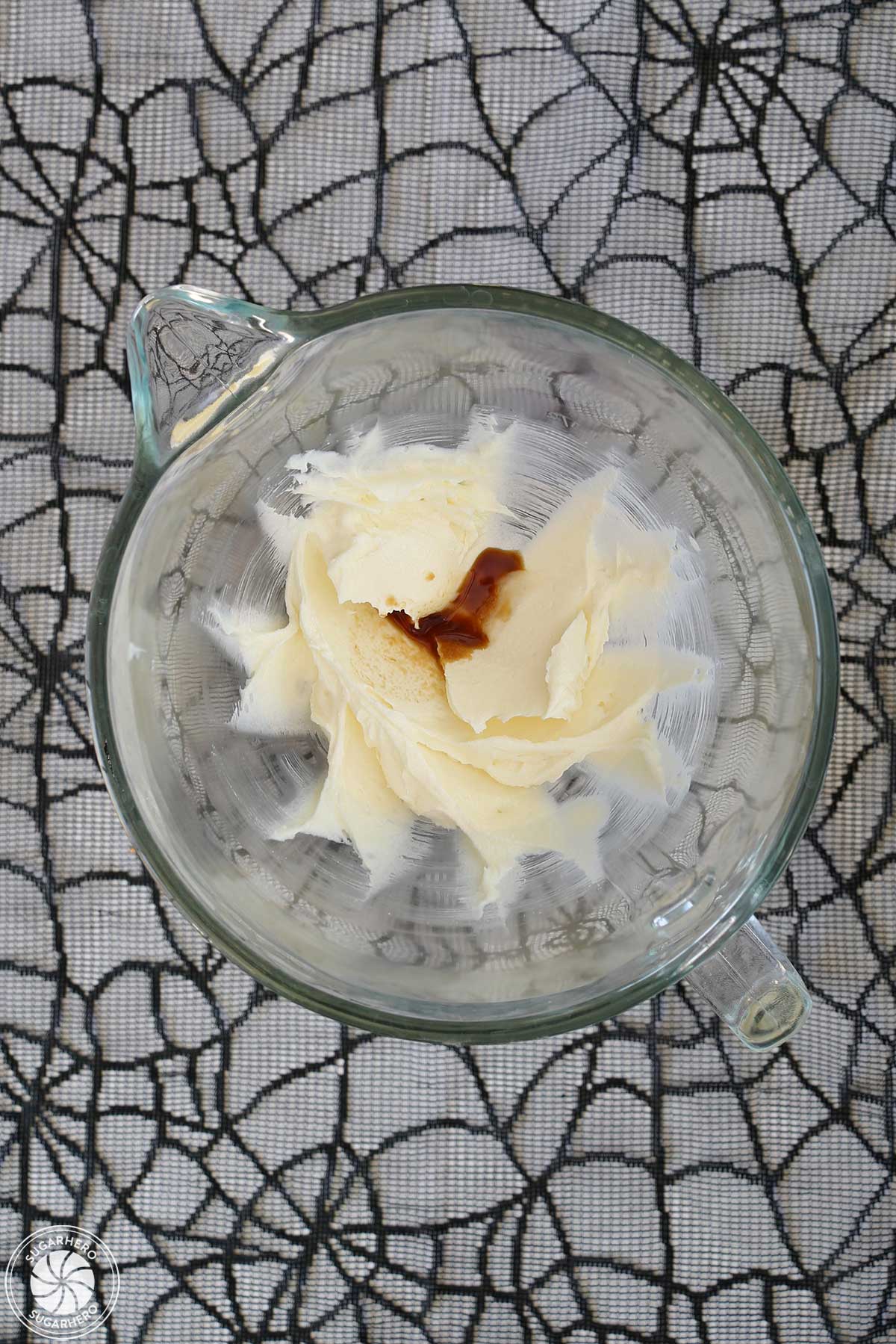 Overhead shot of butter and sugar creamed together, with vanilla extract added.
